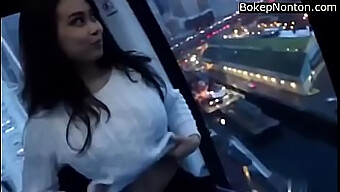 Stunning Young Asian Woman Reveals Her Large Breasts In A Public Setting.